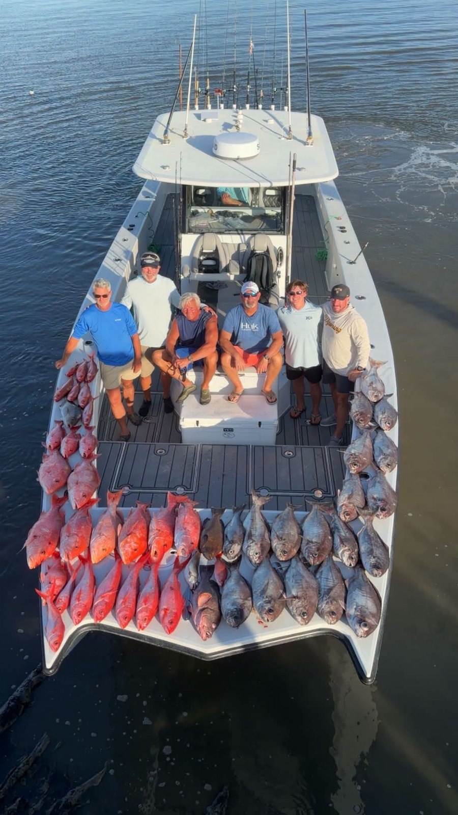 Group with their bottom-fishing catch on the DTB dock