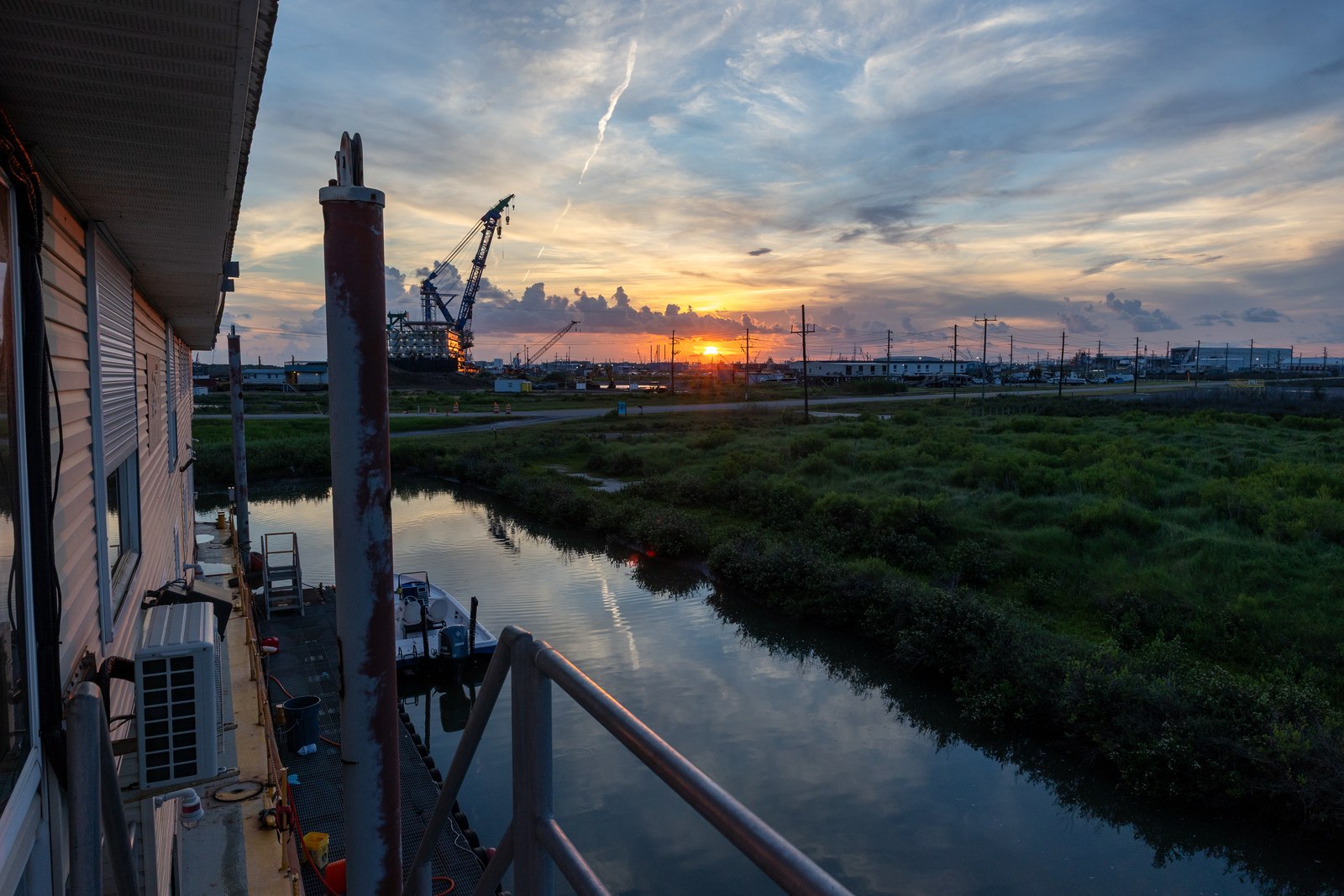 Outdoor landing and waterfront at sunset