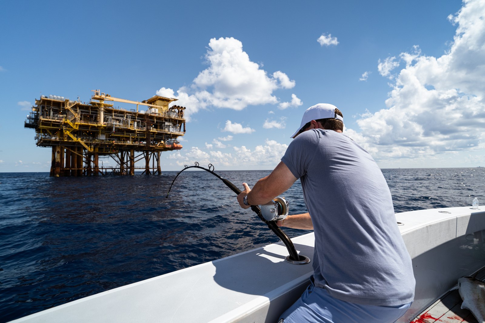 Angler fighting a fish on a DTB offshore trip